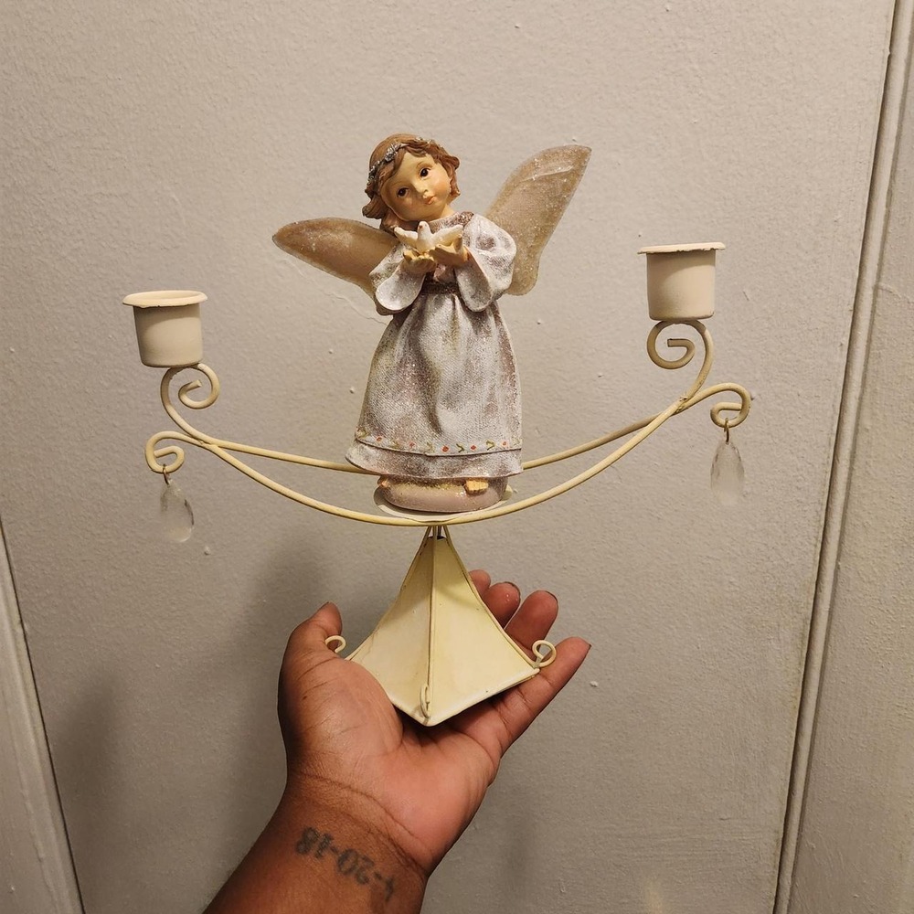 Beautiful Vintage angel candle holder featuring a sweet angel figurine